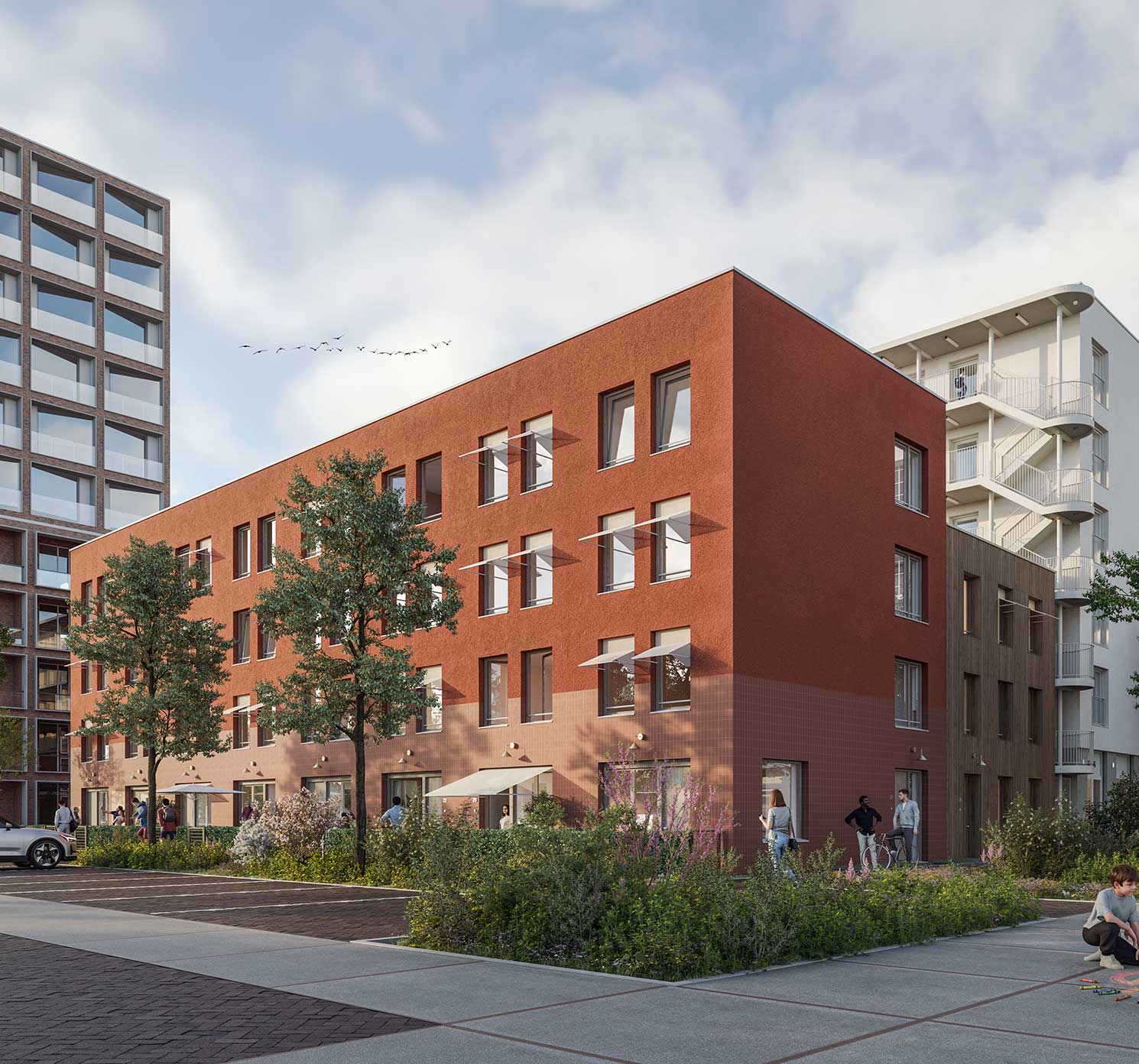 Impressie van de stadswoningen: rode bakstenen gevel met groene voortuinen