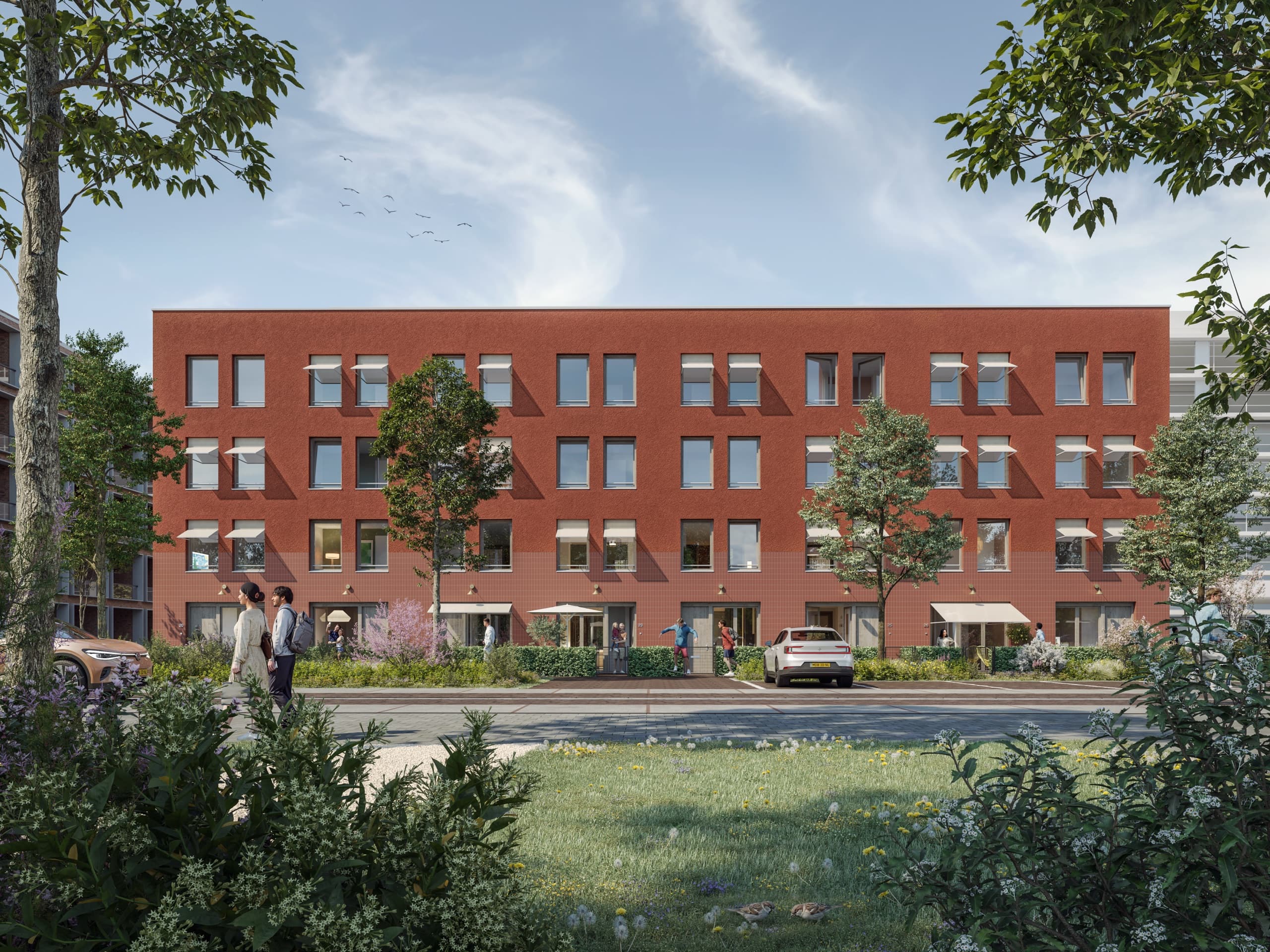 Impressie van de stadswoningen van Blend: rode bakstenen gevel aan het groen